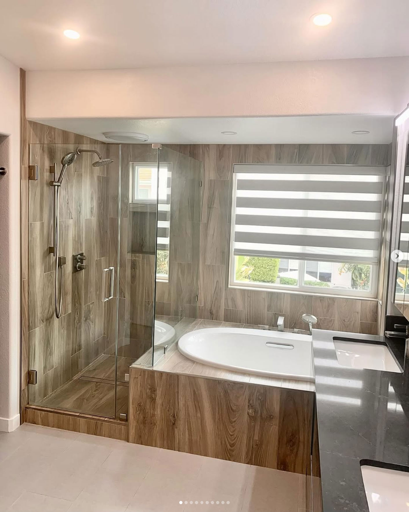 bathroom remodeling featuring wood panels on shower and bath tab areas