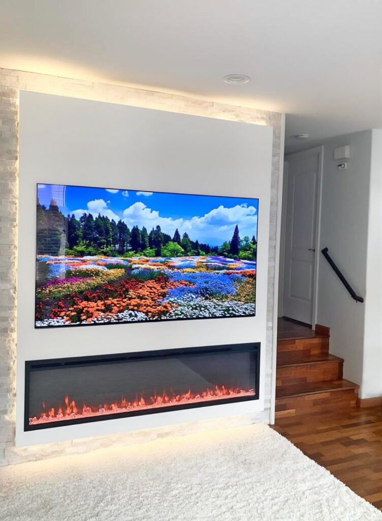 electric fireplace, big TV set on white wall