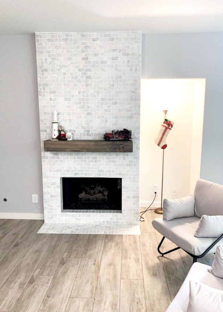 white bricks finish for fireplace and a chair