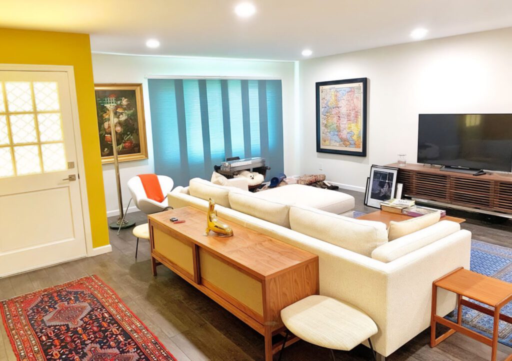 Living room remodeling, white coach, blue window sheds, white walls