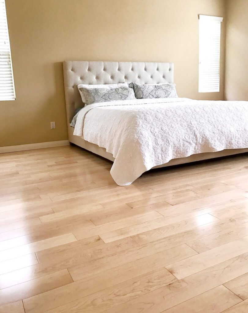 a king size bed inside a master bedroom