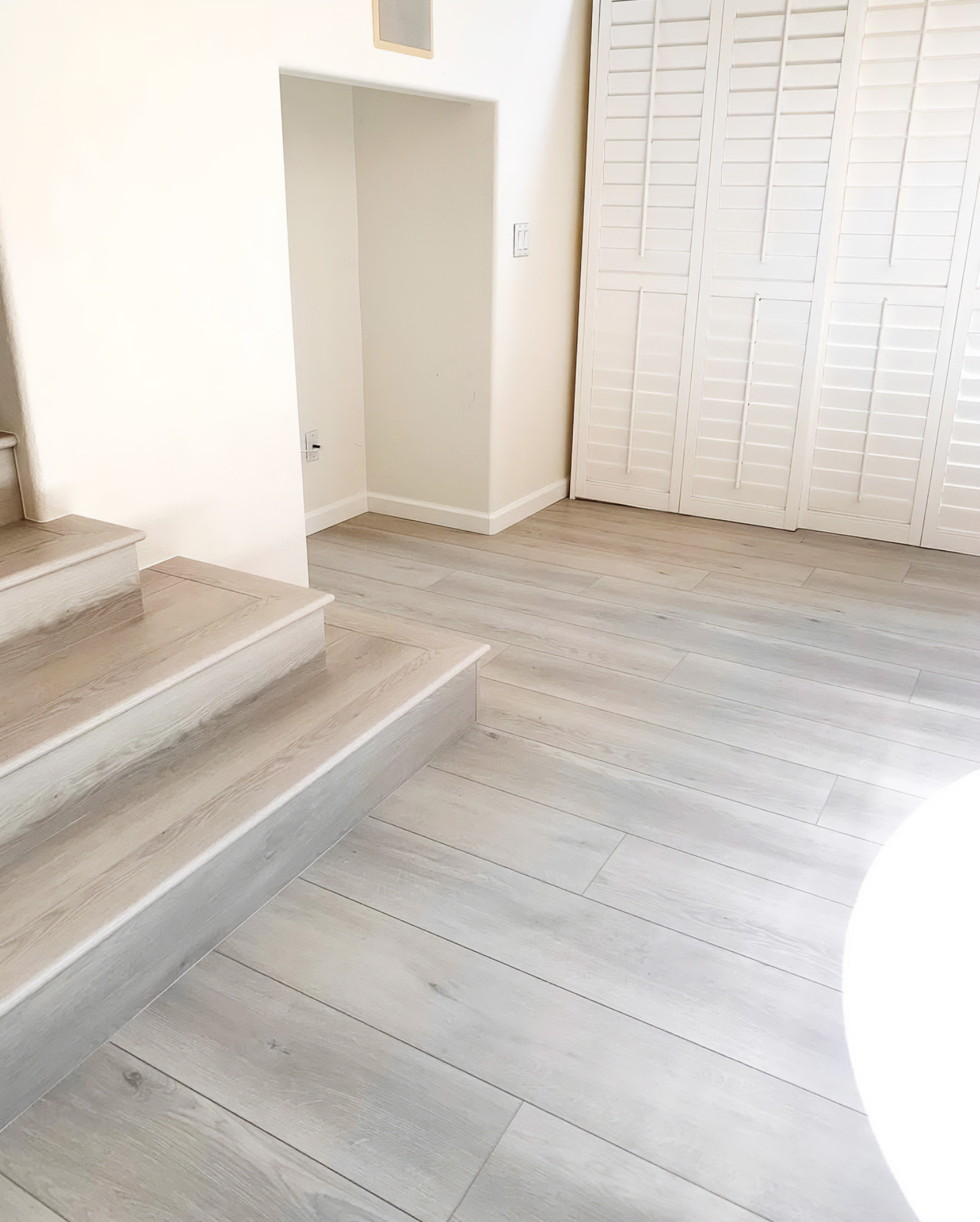 light gray wood finish flooring by OK Construction and remodeling 